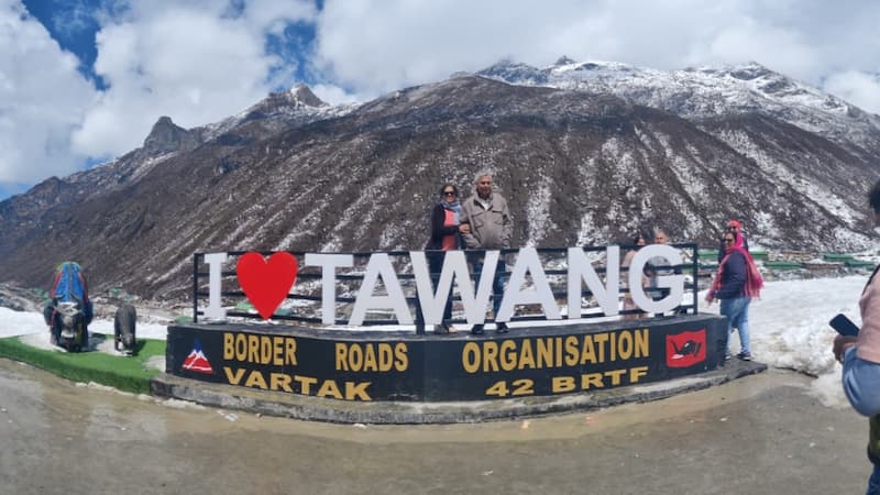 I Love Tawang" BRO signboard with snow-capped mountains in the background, Arunachal Pradesh